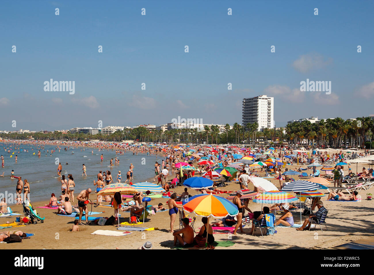 People relaxing and having fun on the beach of Salou, Spain Stock Photo ...