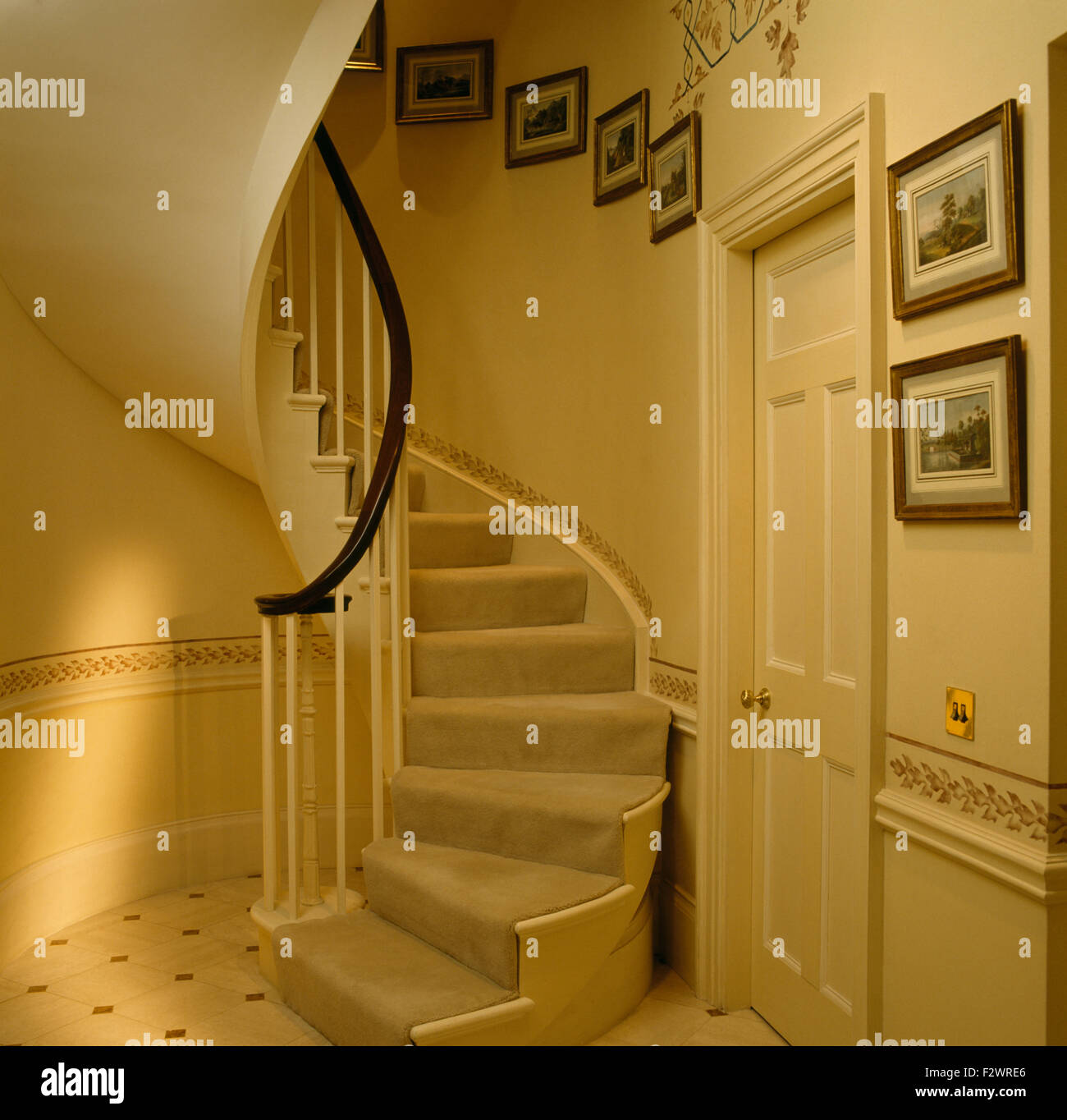 Grey carpet on curved staircase in eighties hall Stock Photo Alamy