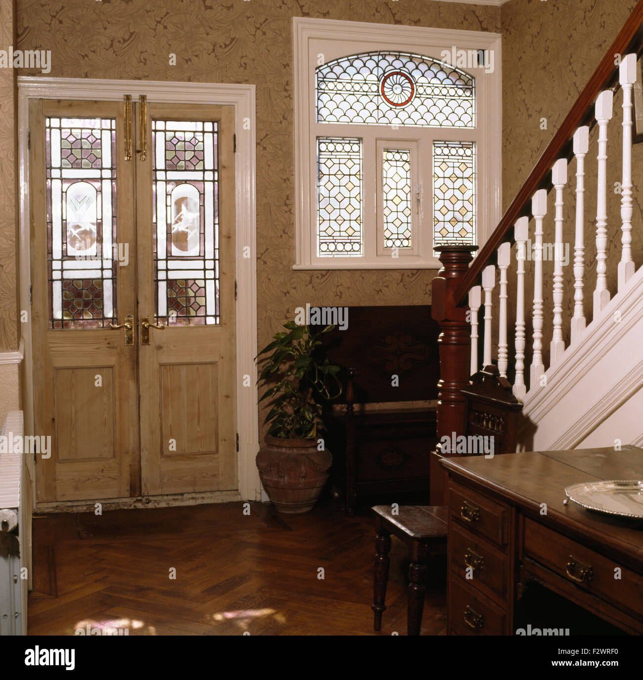 Stained glass panels in door and window in Victorian style hall Stock Photo Alamy