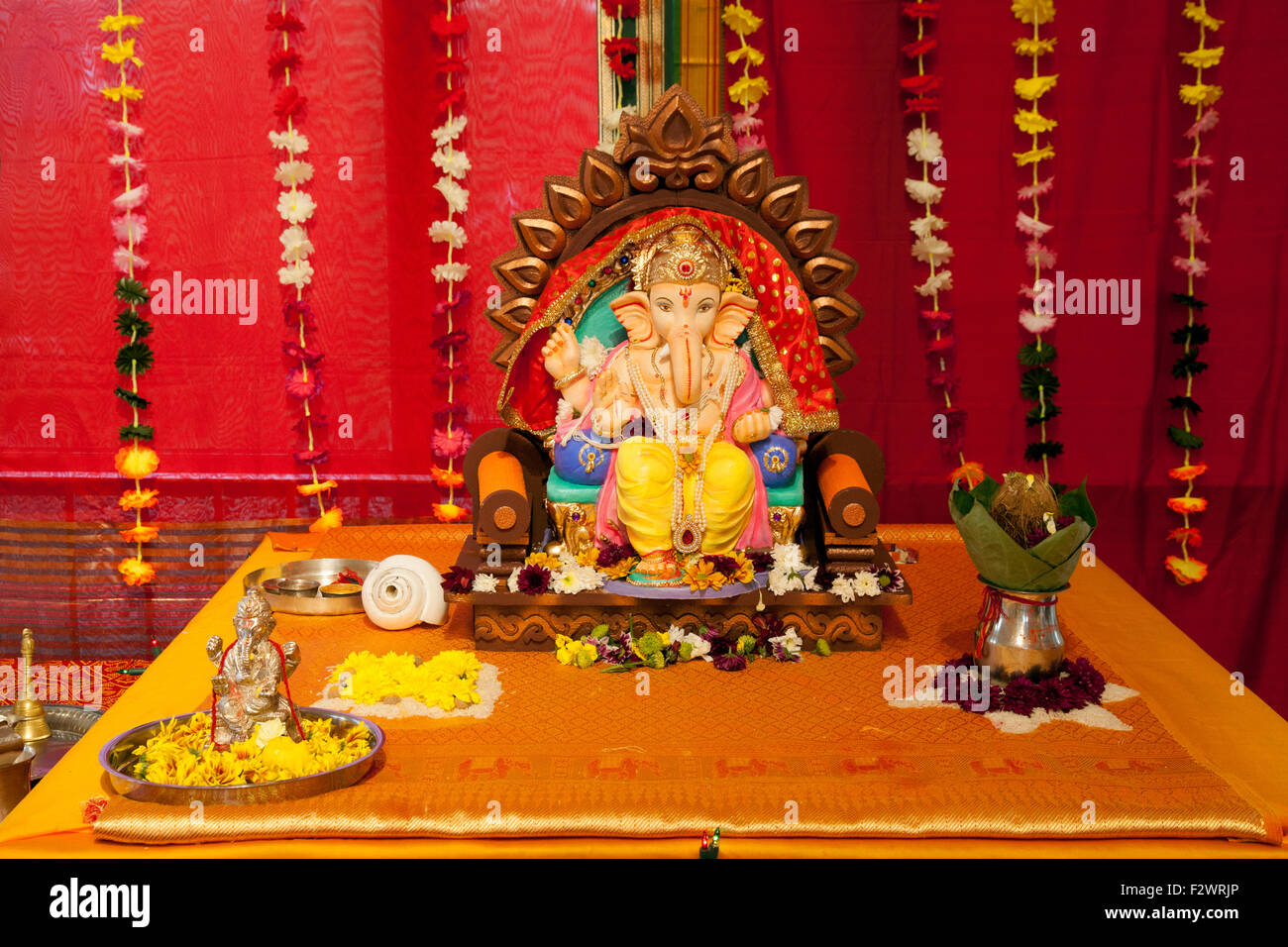An altar to the Hindu God Ganesha or Ganesh, Reading Hindu Temple, Reading, Berkshire England UK Stock Photo