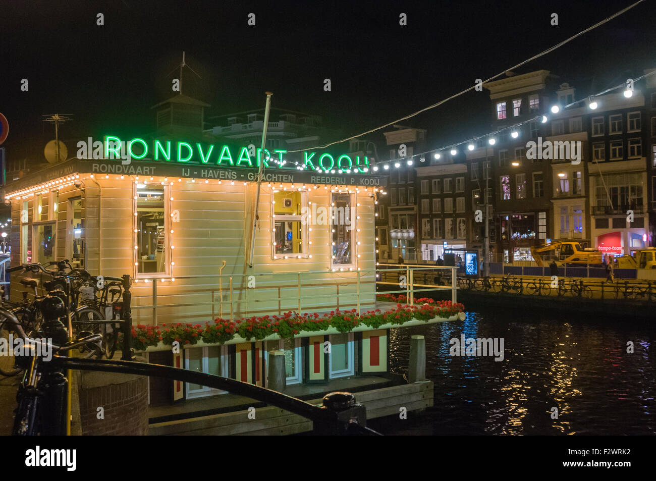 Office of the Rondvaart Koou canalboat tours at night, Amsterdam. Stock Photo