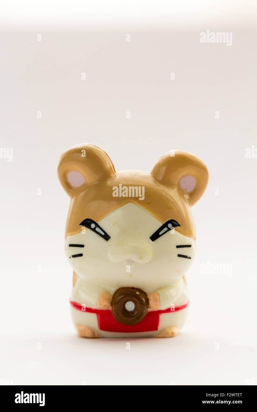 Japanese plastic Anime Hamtaro hamster cartoon character, Howdy, from the Ham-Ham gang. Anime figure against white background. Stock Photo