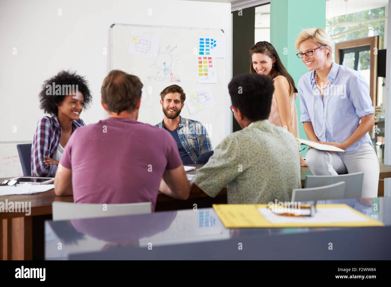 Creative business team having meeting hi-res stock photography and ...