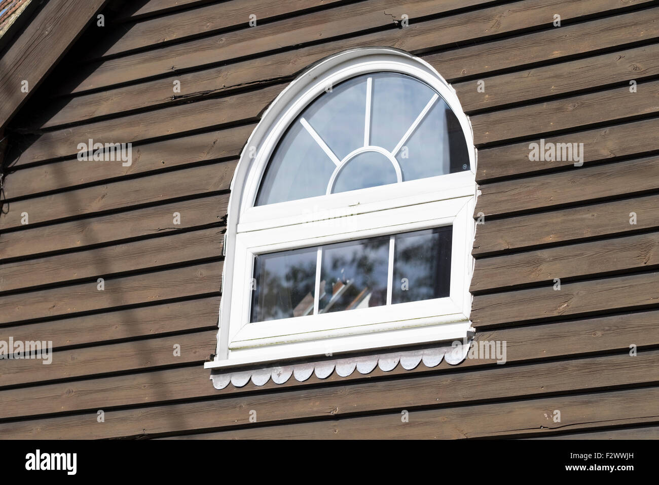 Traditional Weather Boarding at Aldington, Kent with a rounded window. Stock Photo