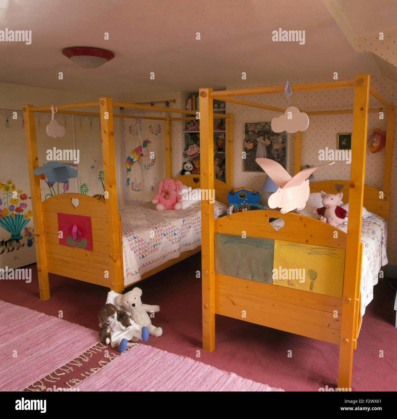 Twin wooden beds in children's nineties bedroom Stock Photo