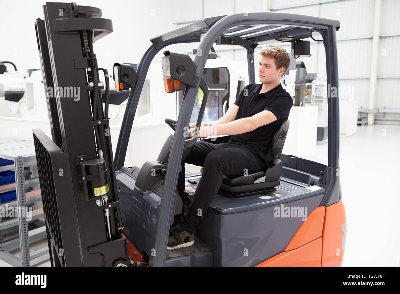 Male Fork Lift Truck Driver Working In Factory Stock Photo Alamy