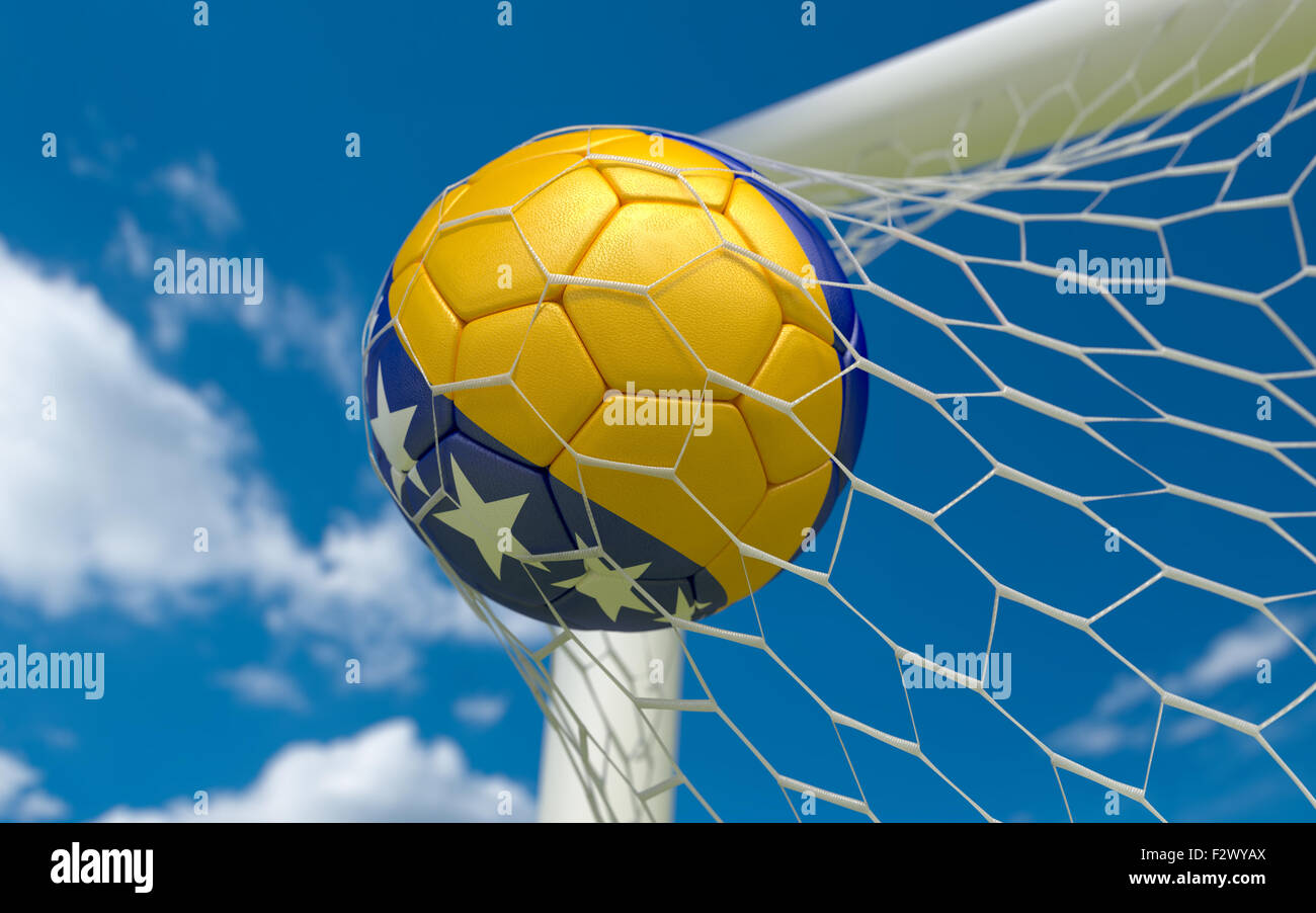 Bosnia and Herzegovina flag and soccer ball, football in goal net Stock