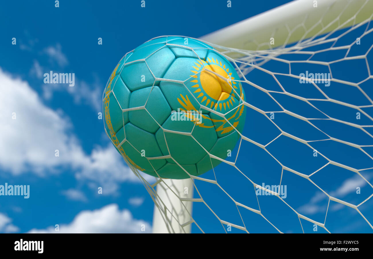 Kazakhstan flag and soccer ball, football in goal net Stock Photo - Alamy
