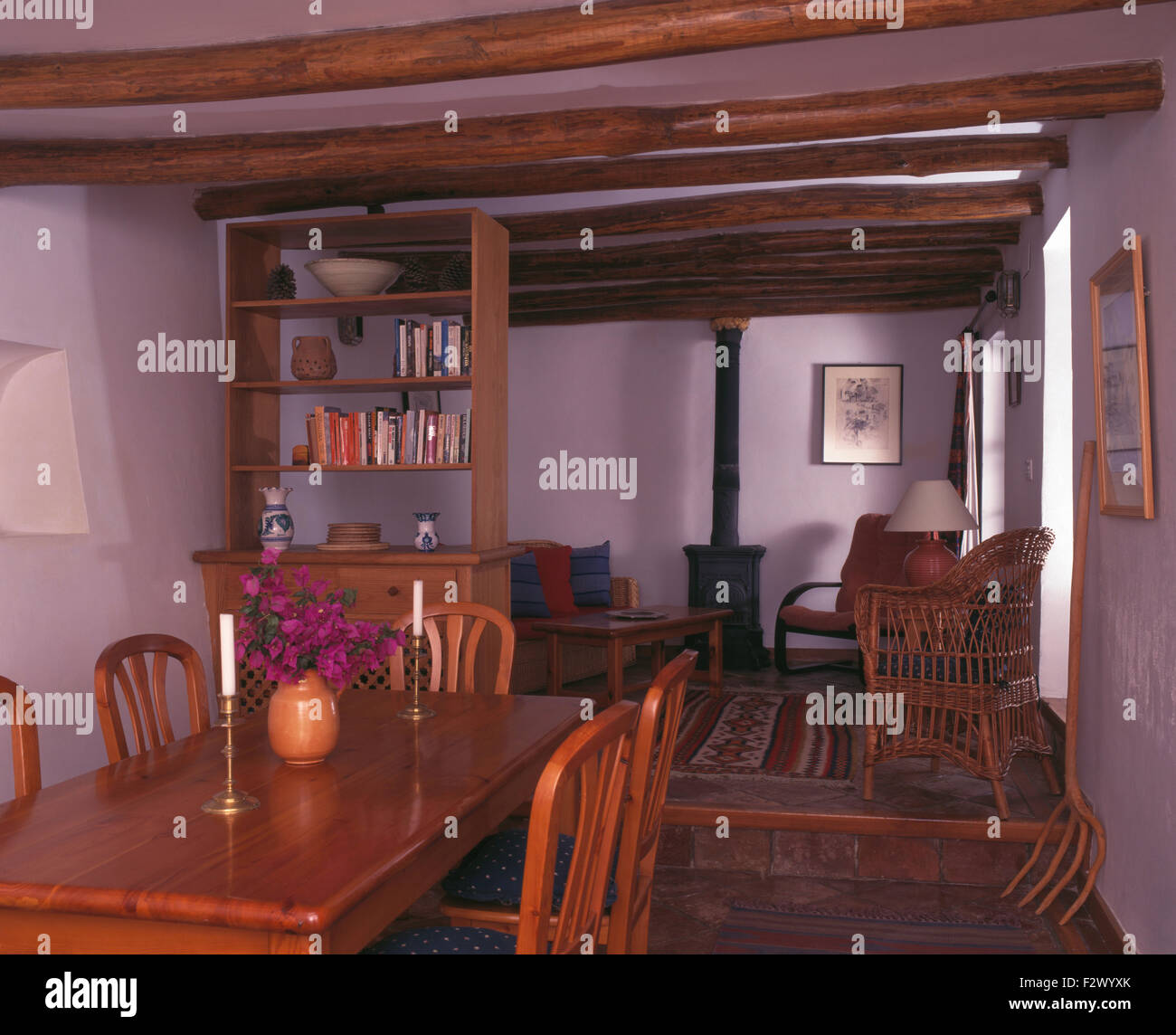 https://c8.alamy.com/comp/F2WYXK/wooden-chairs-and-table-in-spanish-cottage-dining-room-with-a-wood-F2WYXK.jpg