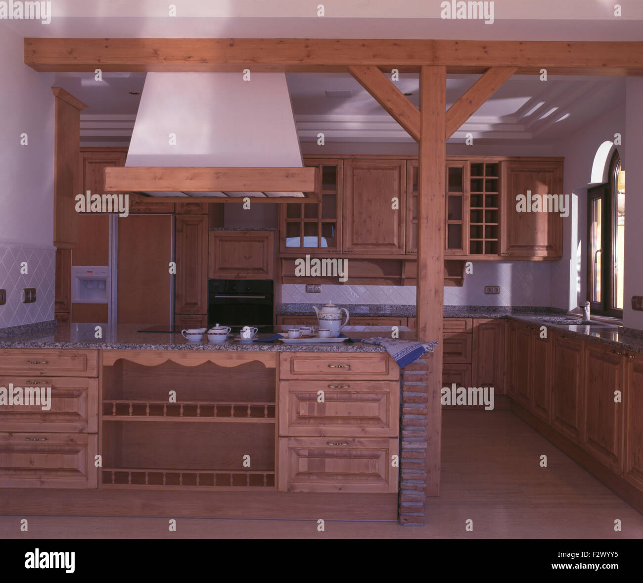 Fitted wooden units in newbuild Spanish kitchen Stock Photo Alamy