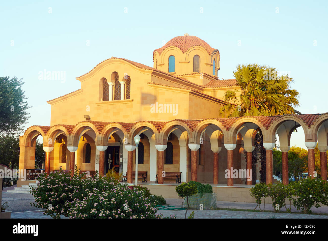 cloister and facade of the Orthodox church in Faliraki on Rhodes island Stock Photo