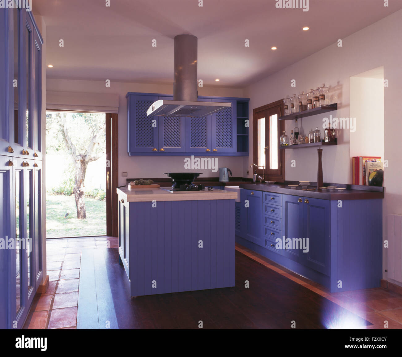 Blue fitted units in modern Spanish kitchen Stock Photo Alamy