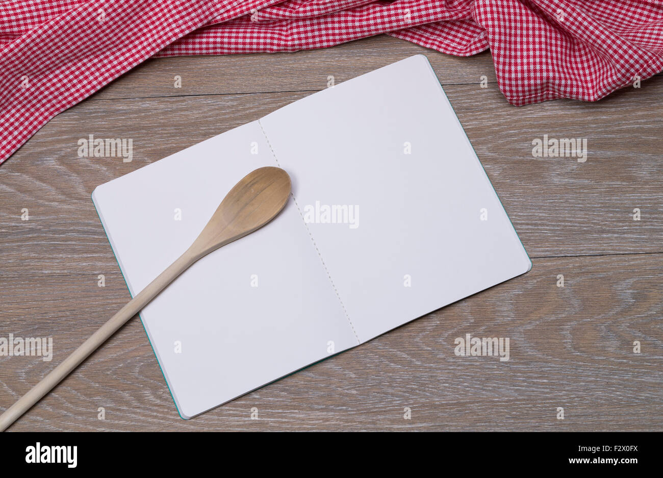 Image shows an open booklet with pen on a vintage table Stock Photo