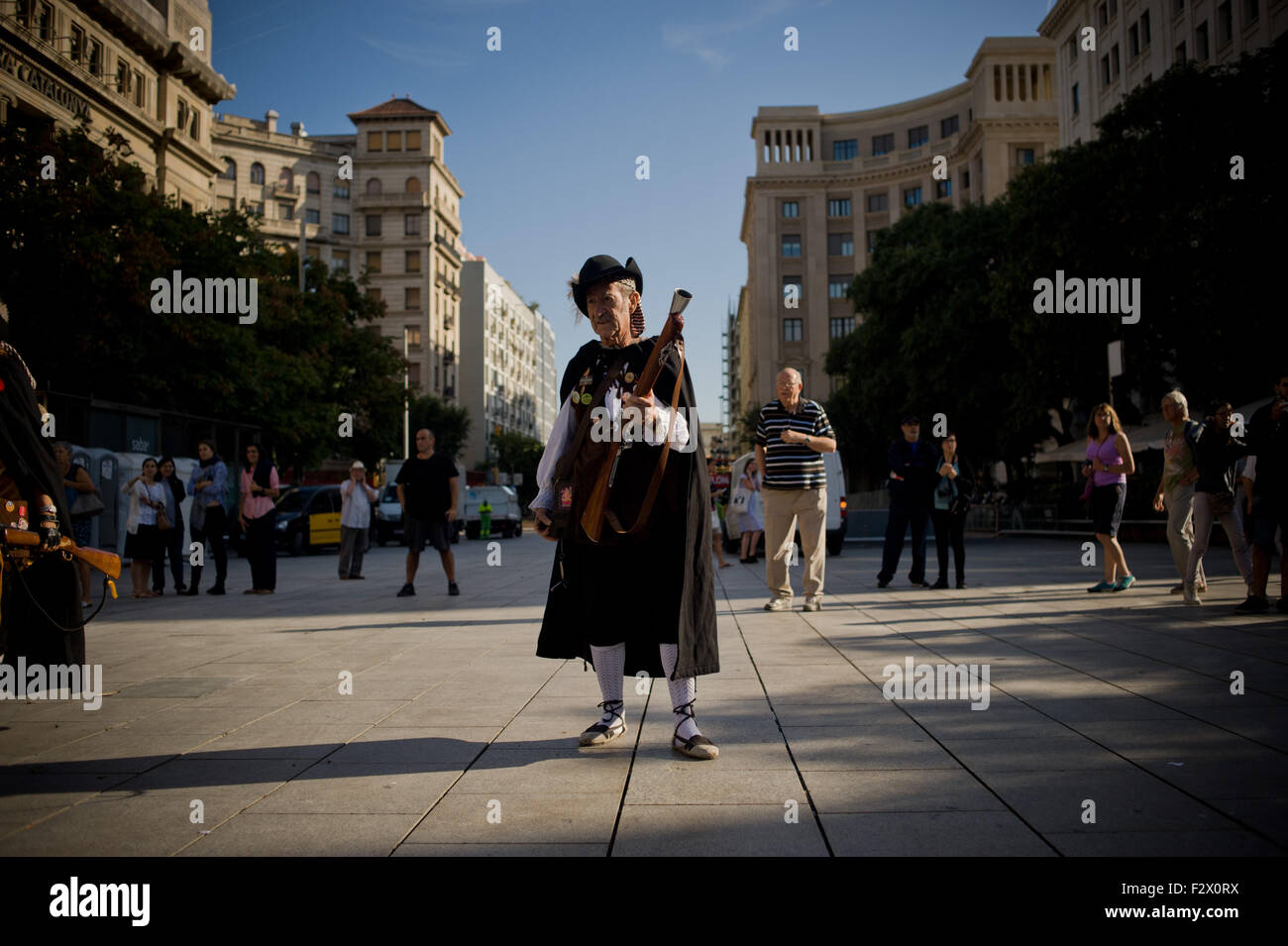 Barcelona, Catalonia, Spain. 24th Sep, 2015. A trabucaire through the streets of Barcelona on the occasion of the celebrations of the Merce Festival (Festes de la Merce) on 24 September 2015, Spain. The Galejada Trabucaire marks the beginning of the day of the patron saint of Barcelona, La Merce. Men and women dressed as ancient Catalan bandits take to the streets of the old part of Barcelona and cause a loud noise with his blunderbusses full of gunpowder. © Jordi Boixareu/ZUMA Wire/Alamy Live News Stock Photo