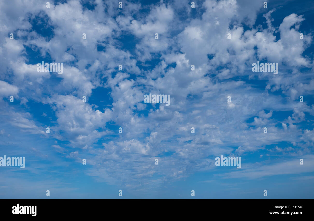White clouds in a blue summer sky Stock Photo - Alamy
