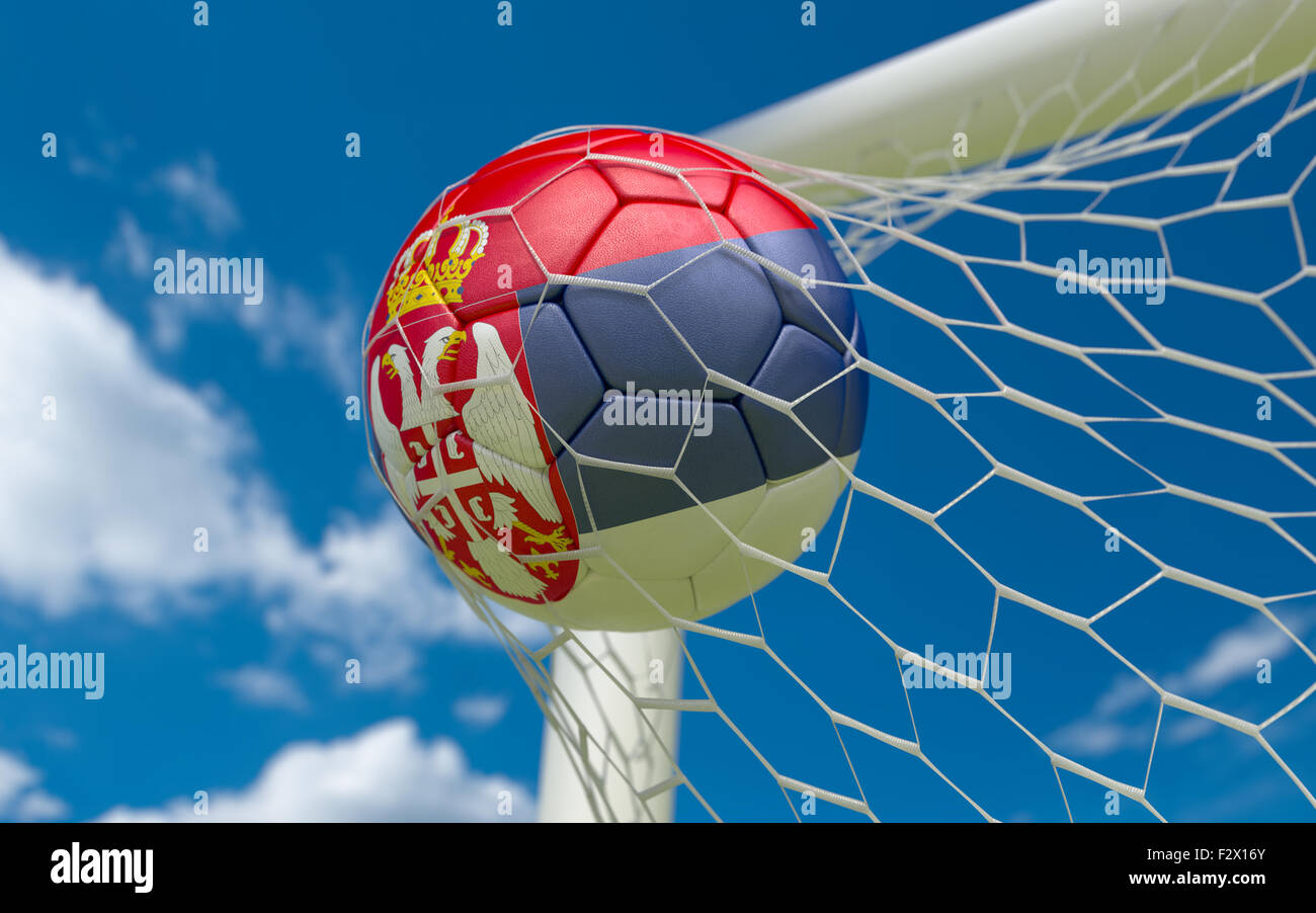Serbia flag and soccer ball, football in goal net Stock Photo - Alamy