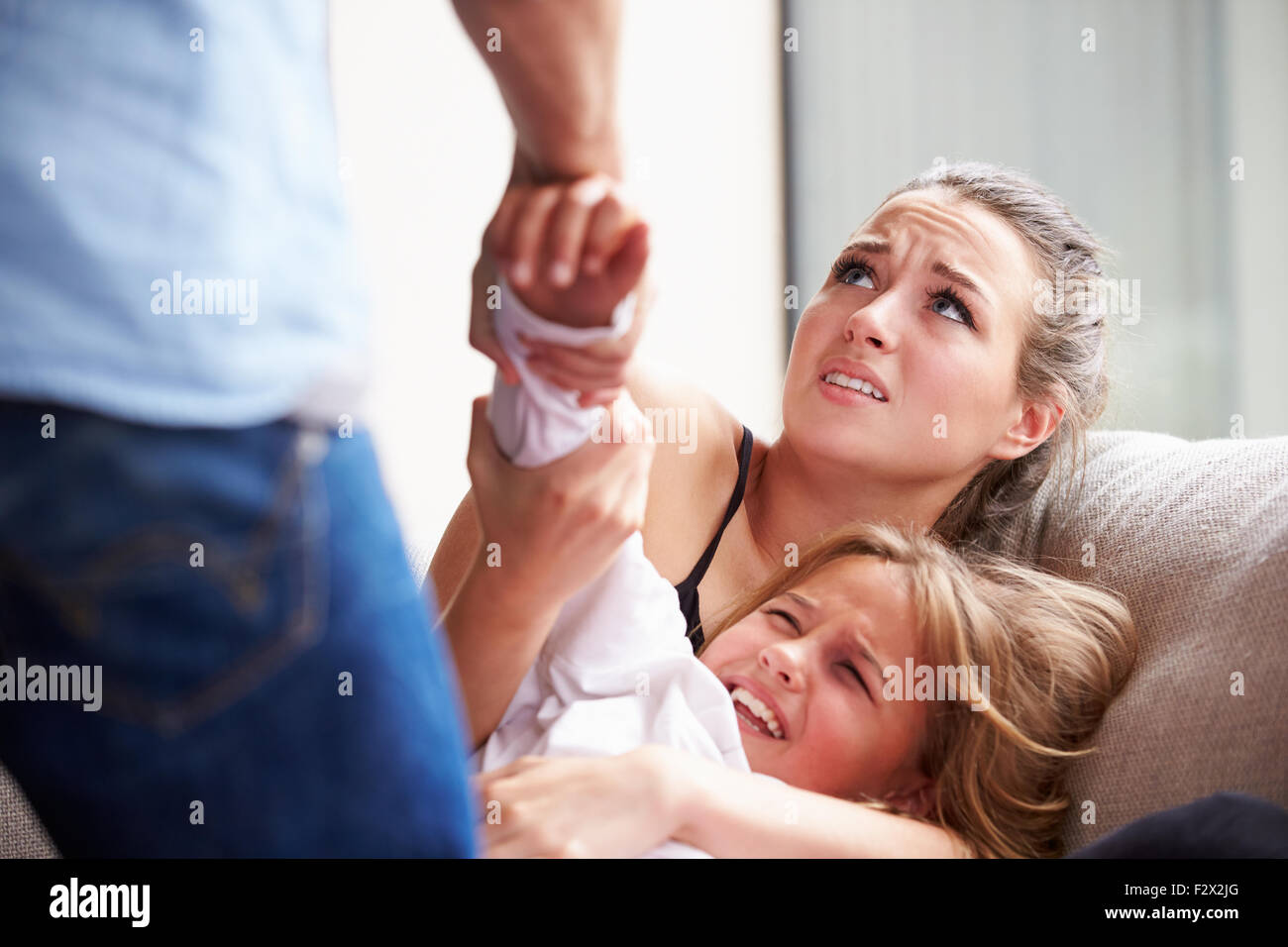 Man Being Physically Abusive Towards Family Stock Photo