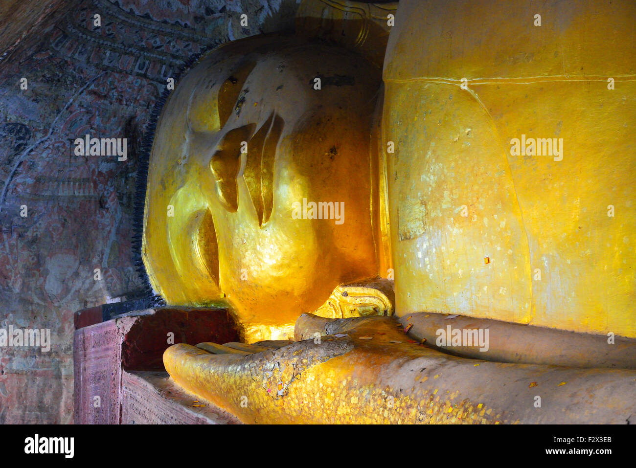 Gold head of giant lying buddha at the Hpo Win Daung cave complex also known as Pho Win Taung caves, Upper Burma, Myanmar (formerly Burma) Stock Photo