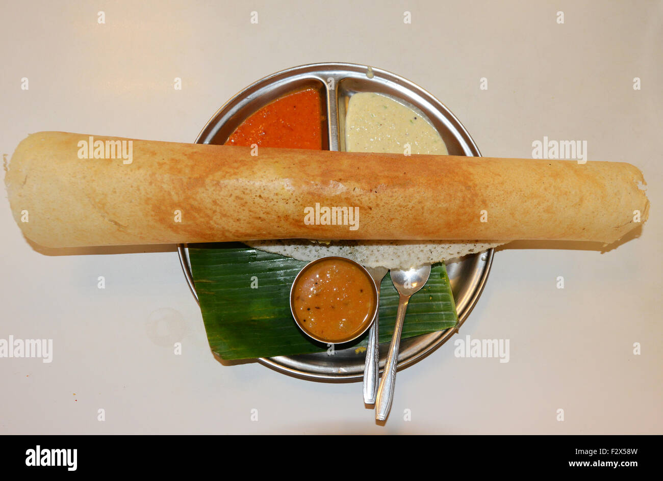 Masala Dosa served with different chutney sauce. Stock Photo