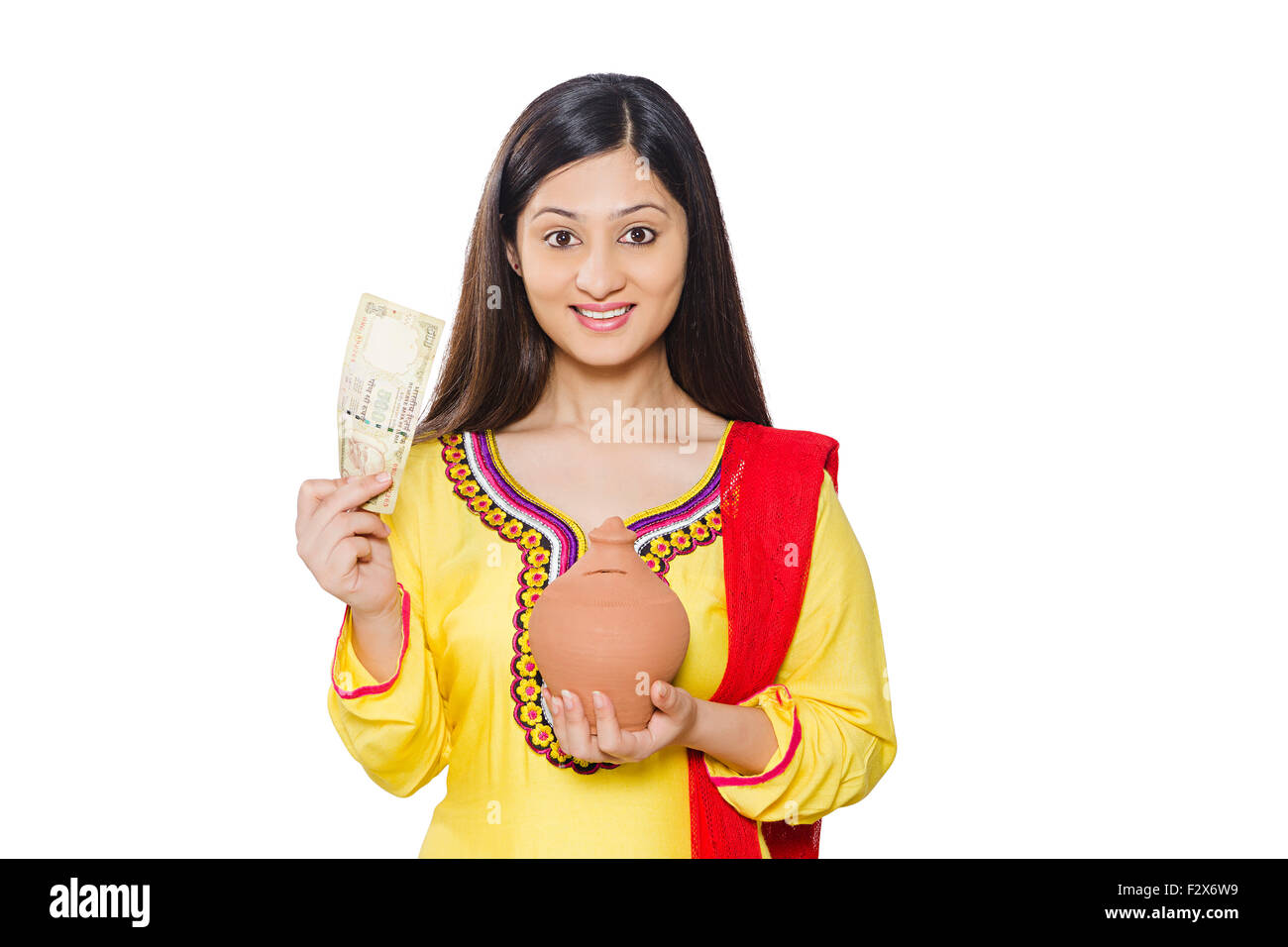 1 indian Woman Housewife Saving money Piggy Bank Stock Photo - Alamy