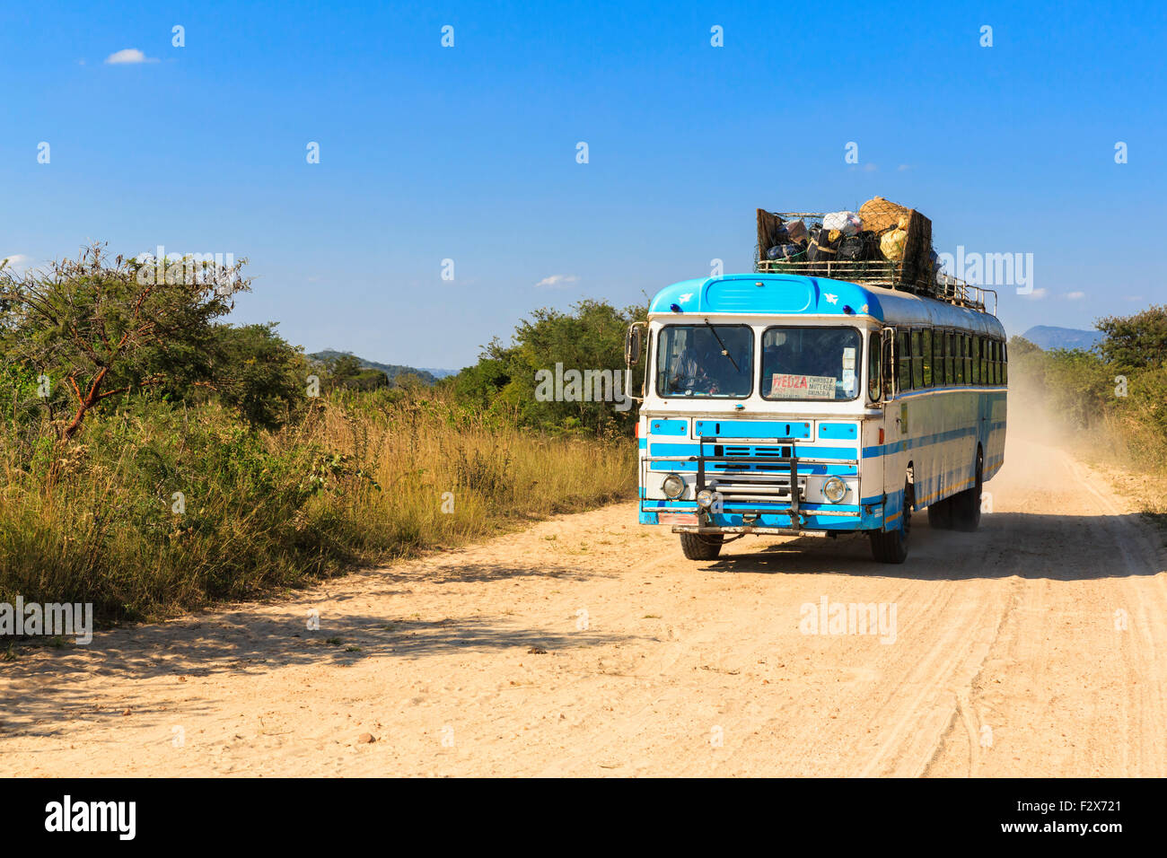 Zimbabwe, driving coach on a dirt road Stock Photo