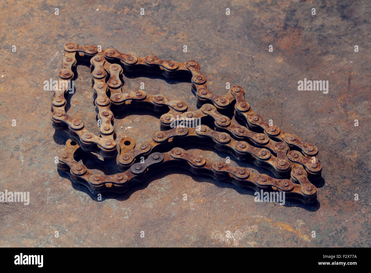 Old rust chain on metal work bench Stock Photo Alamy