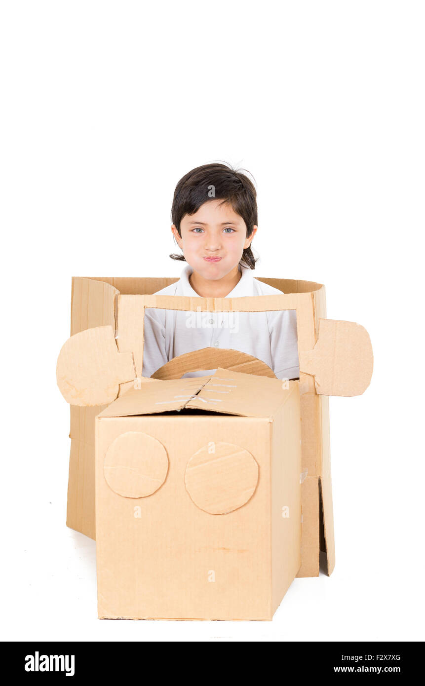 Adorable young boy sitting in a cardboard car playing isolated over ...