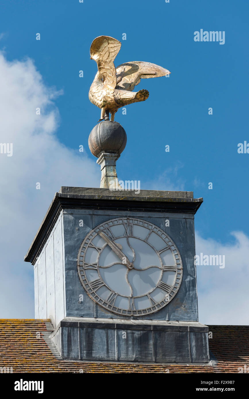 Copper swan statue on The Old Town Hall clock, Market Square, Buckingham, Buckinghamshire, England, United Kingdom Stock Photo