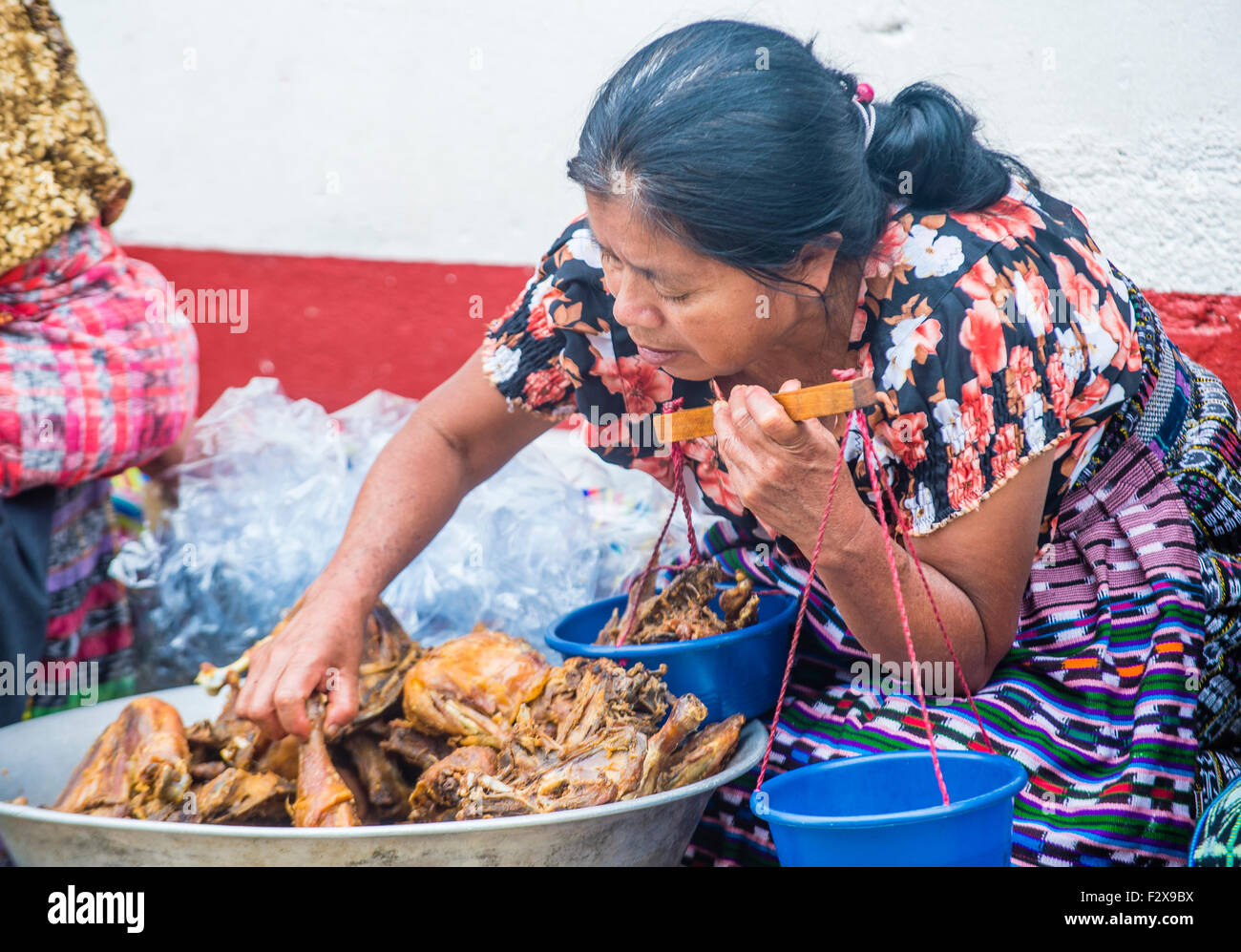 Guatemalan woman Sell fried chicken in the Chichicastenango Market Stock Photo