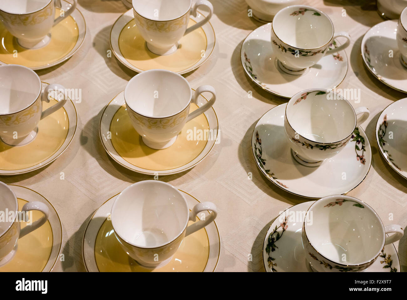 Many tea cups and saucers are on table Stock Photo Alamy
