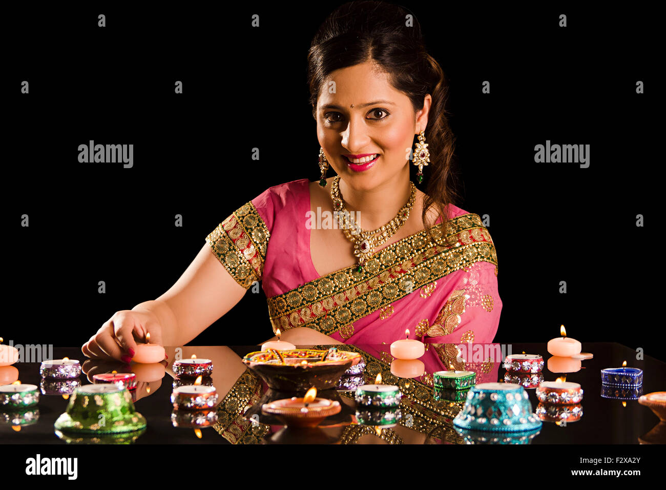 1 indian Adult Woman Diwali Festival Decoration  Diya Stock Photo