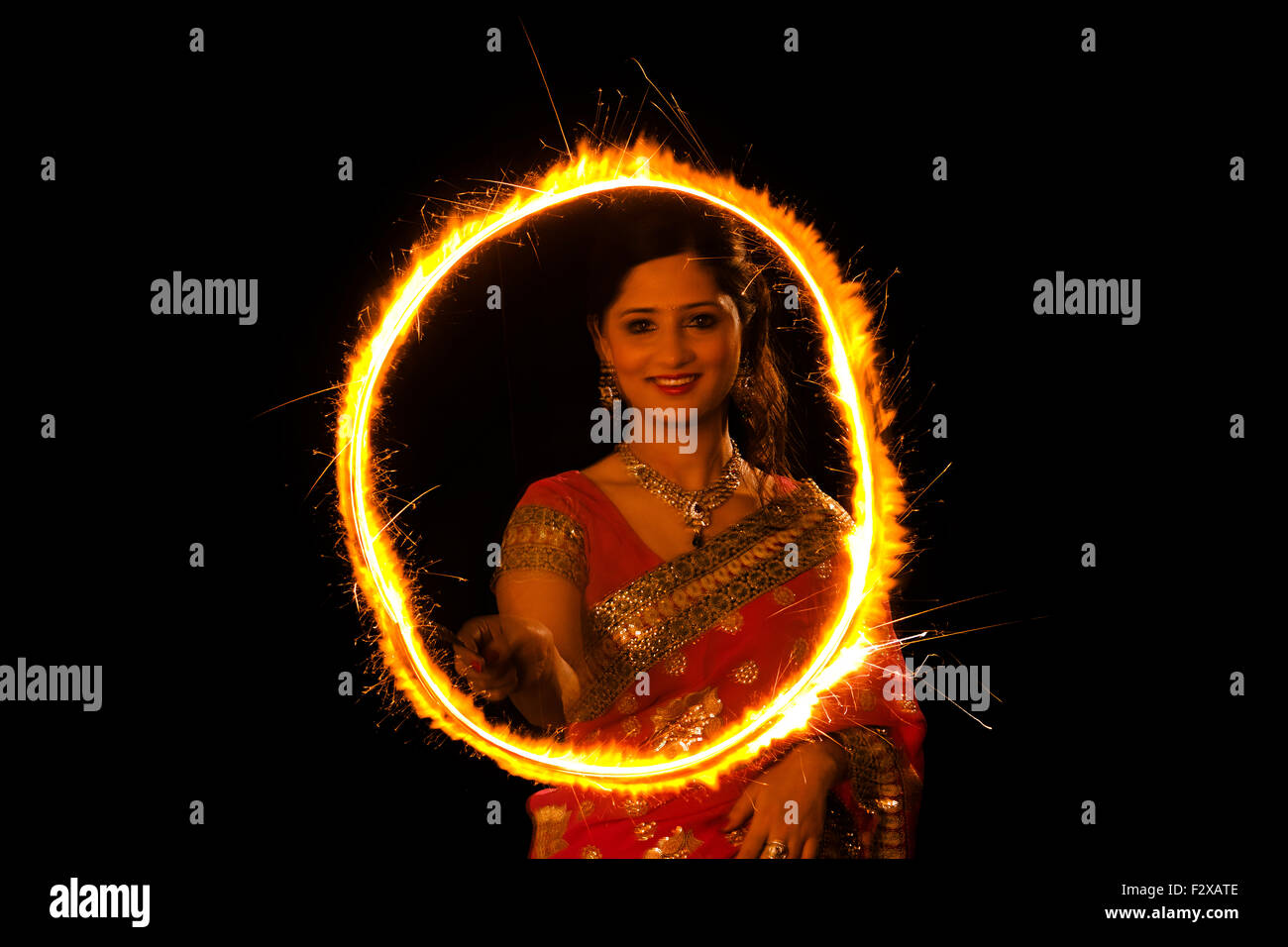 1 indian Adult Woman Diwali Festival Playing Fire Cracker Stock Photo