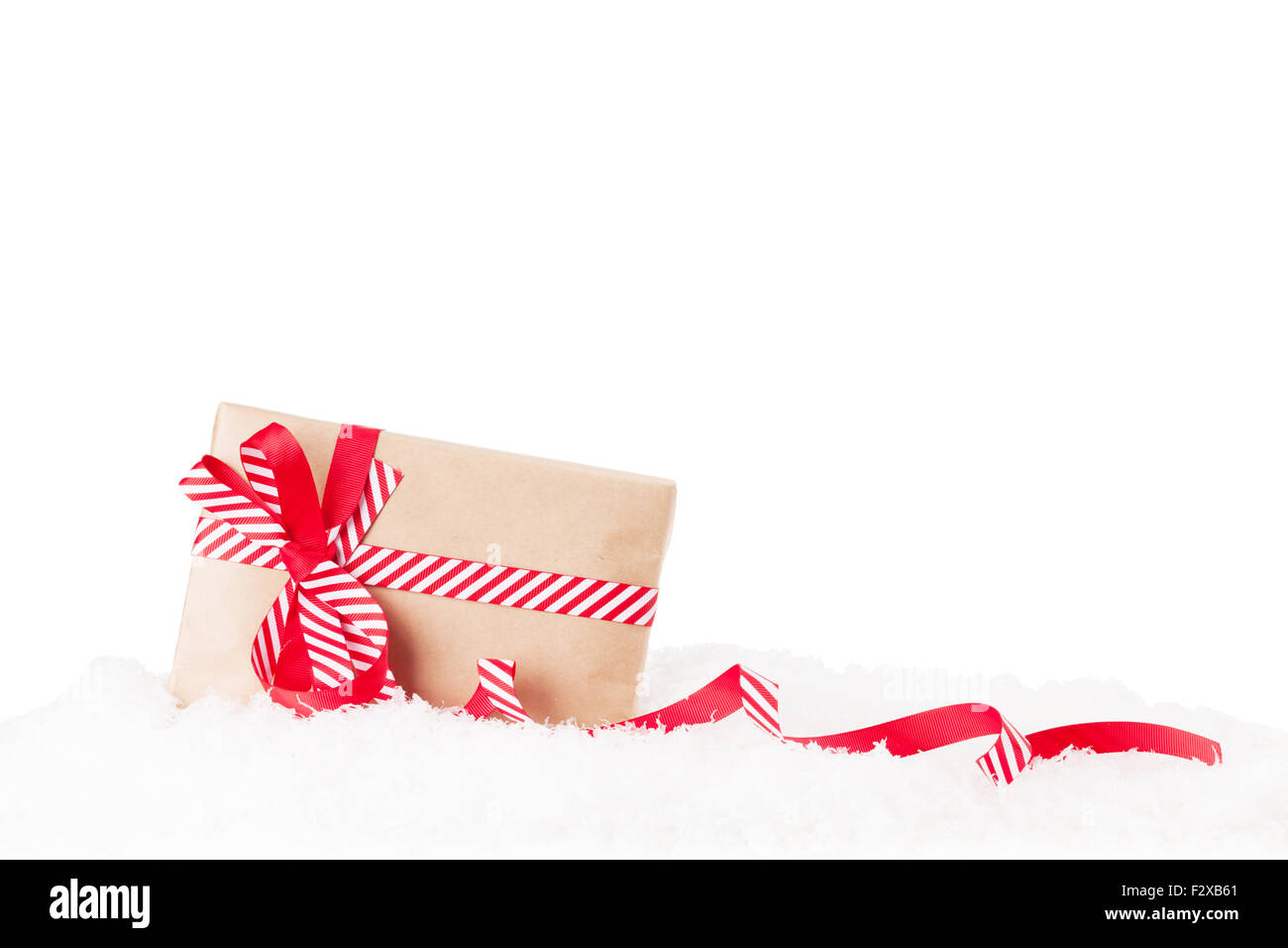 Christmas gift box in snow. Isolated on white background Stock Photo ...