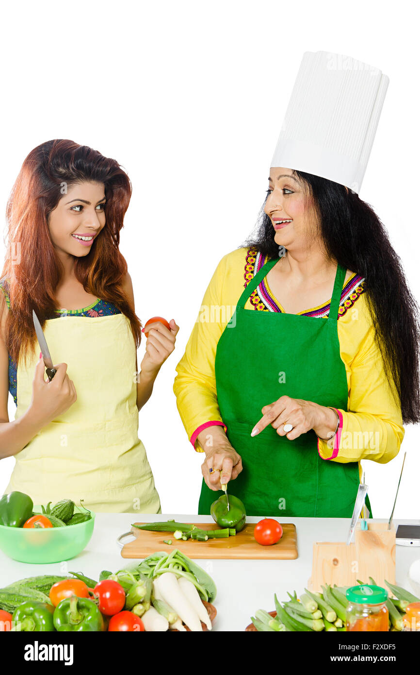 2 indian Adult Woman mother and daughter Kitchen Cooking Stock Photo