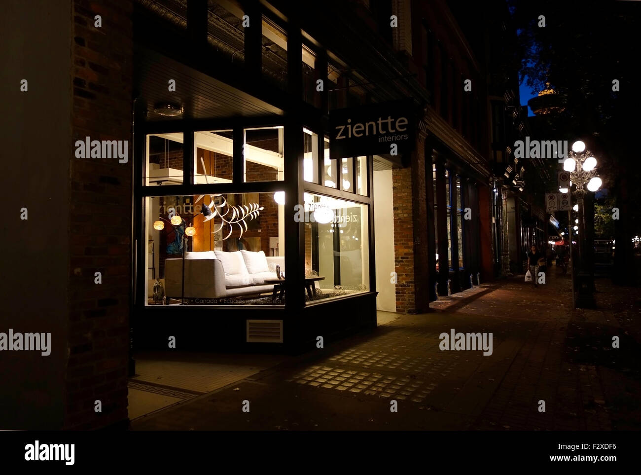 Storefront window display at night of a modern furniture store "zientte