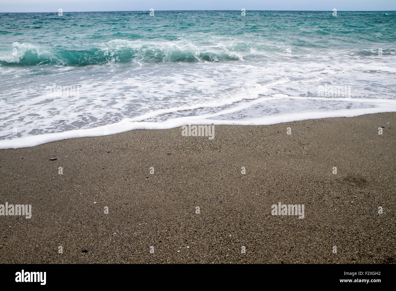 summer with beautiful beach in Calabria in rough seas Stock Photo