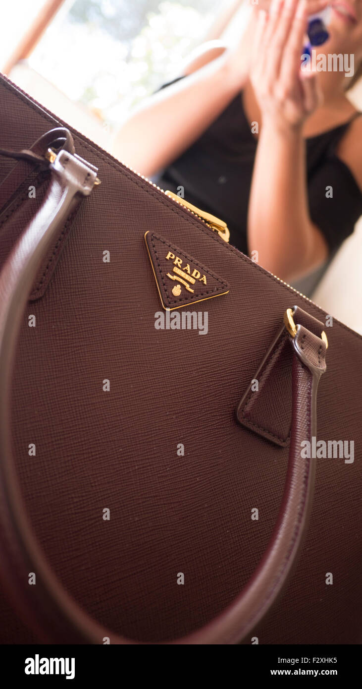 Young female with Prada bag purse handbag Stock Photo - Alamy