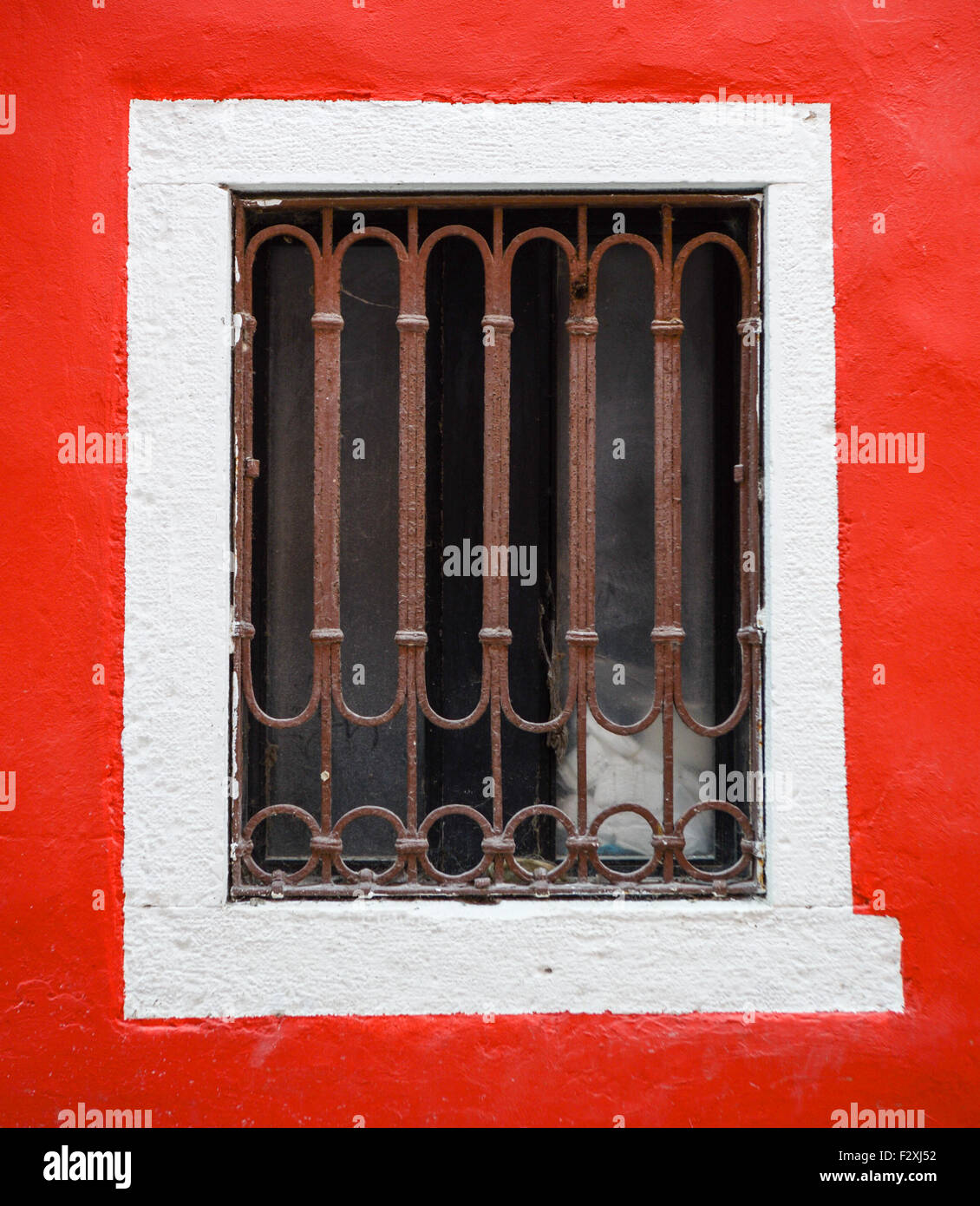 old window with metal bars on red wall Stock Photo - Alamy