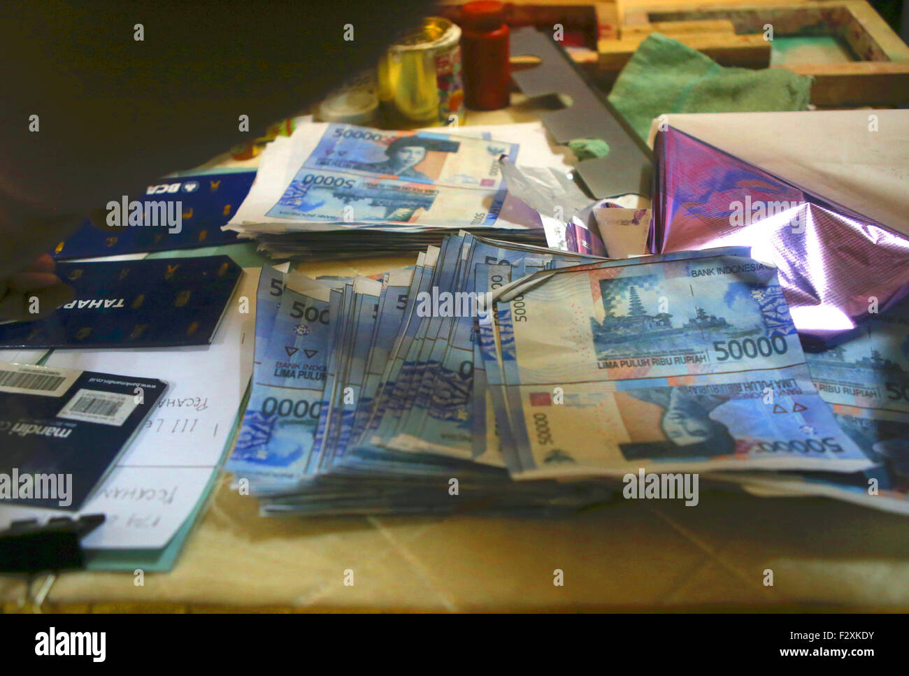 Evidence of counterfeit money seized from suspects © Denny Pohan/Alamy Live News Stock Photo