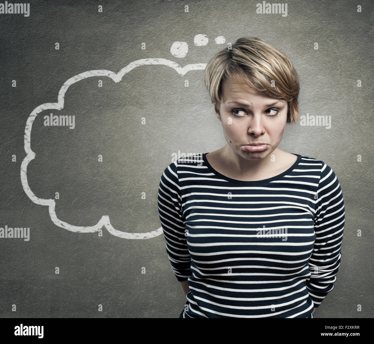 Illustration of a young woman thinking, with thought balloon Stock Photo