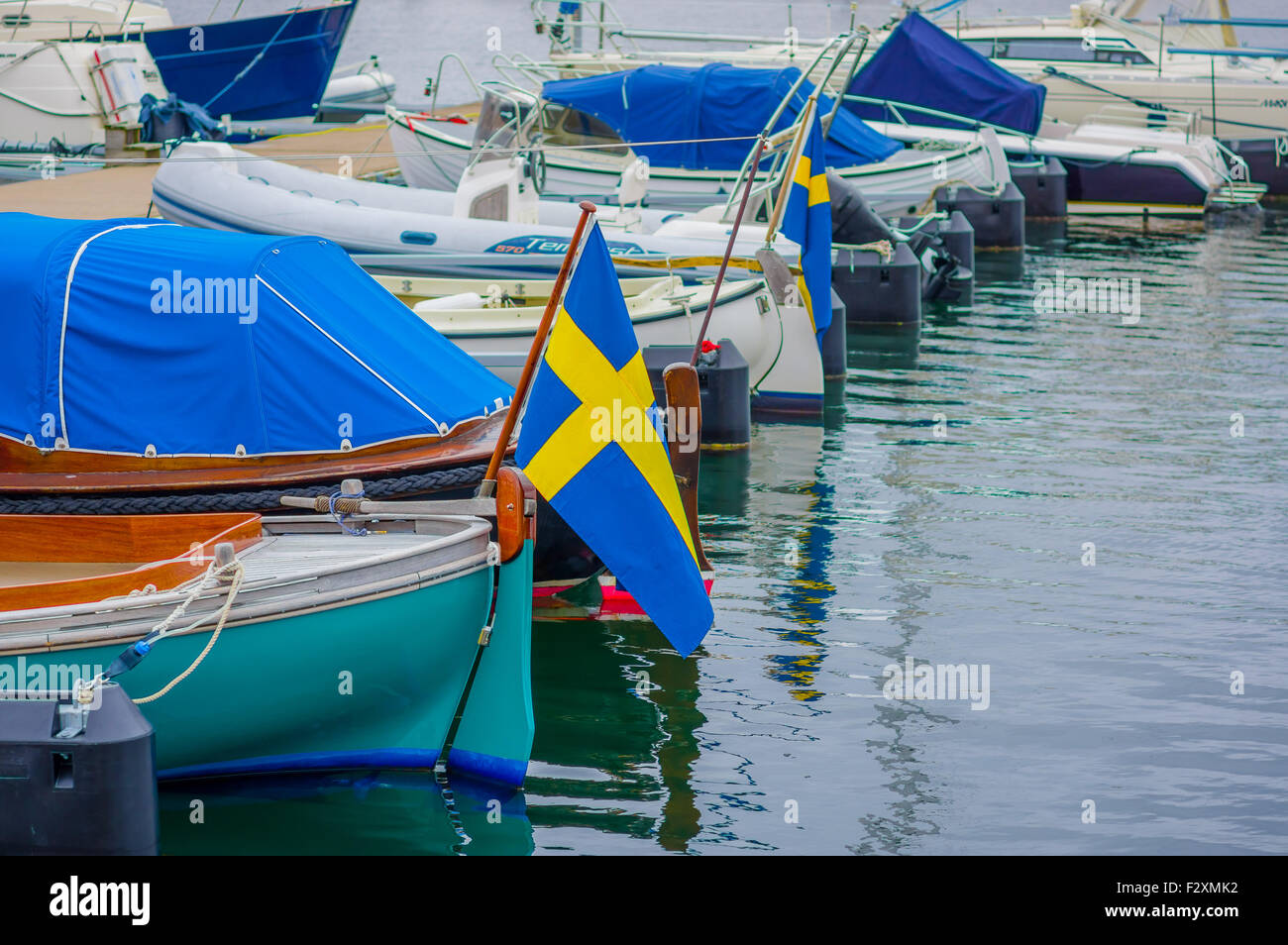 Boats lined up in a dock Stock Photo - Alamy