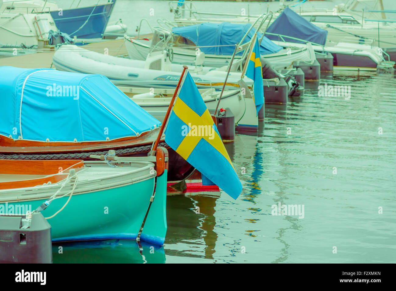 Boats lined up in a dock Stock Photo - Alamy