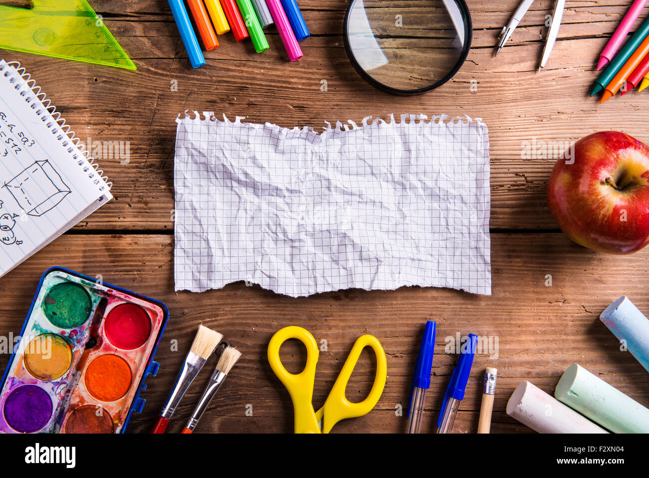 Desk With School Supplies. Studio Shot On Wooden Background Stock Photo 