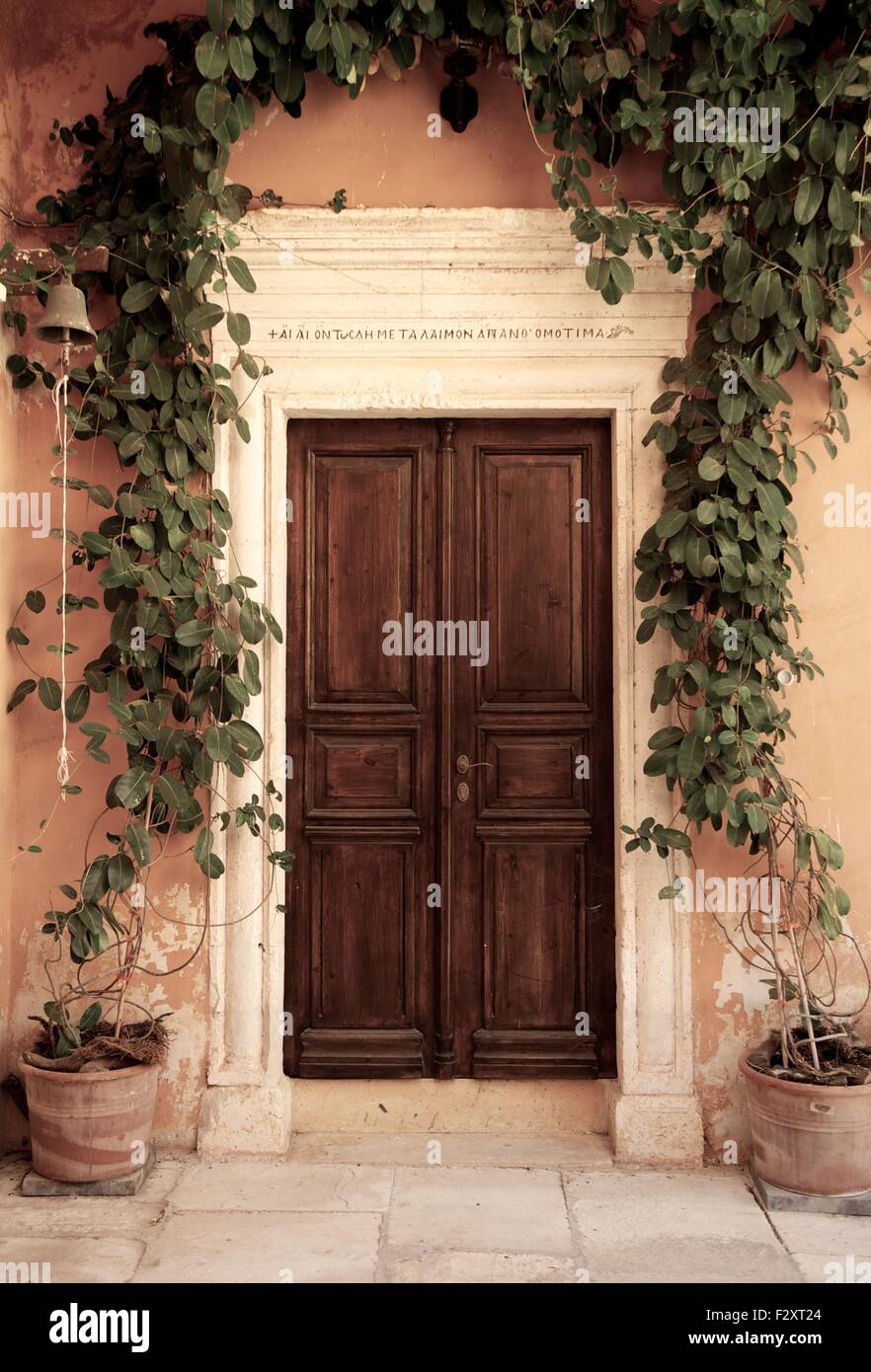 Wooden door of an ancient house Stock Photo - Alamy
