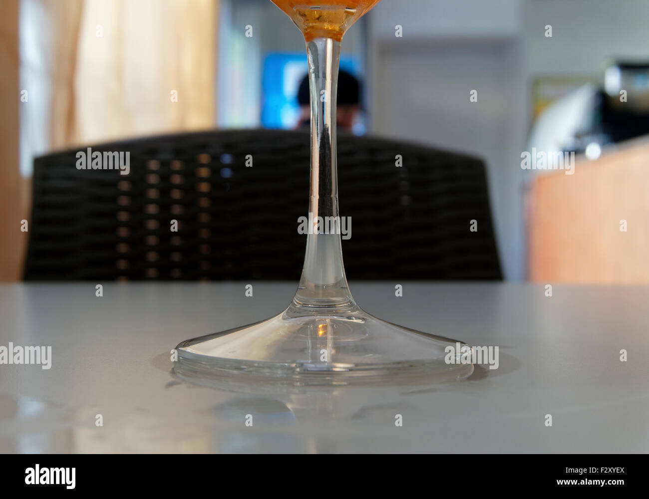Stemmed cocktail glass on table Stock Photo