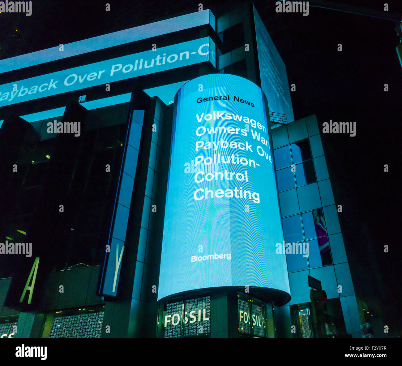 The Morgan Stanley news ticker in New York reports on the Volkswagen emission scandal on Tuesday, September 22, 2015. The U.S. Environmental Protection Agency has alleged that a defeat device built into VW's diesel cars' software will cause the car to appear more environmentally friendly when going through emissions testing. VW faces billions of dollars in fines in the U.S. and potentially other countries, not to mention civil lawsuits. (© Richard B. Levine) Stock Photo