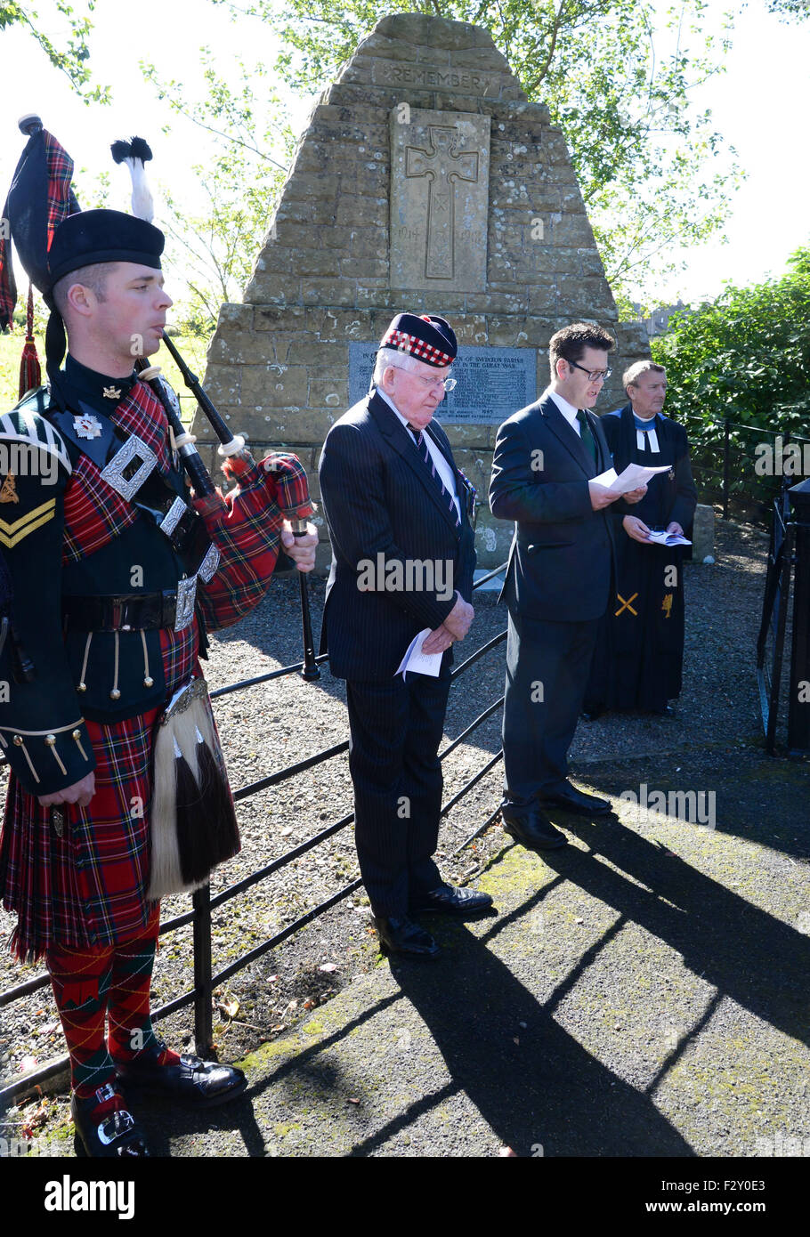 Swinton, UK. 25th Sep, 2015. Kevin Laidlaw, Great Grandson of Piper Laidlaw talks about the actions of Piper Laidlaw, he also talked of the men on the village War Memorial and how his Great Grandfather would have known many of them, and how he hopes that they are not forgotten.  The Laying of the Commerative VC Stone in the small Scottish Border village of Swinton to mark the 100th Anniversary of the award of the Victoria Cross to Piper Daniel Laidlaw for his actions whilst serving with the 7th Battalion of the King's Own Scottish Borderers. Stock Photo