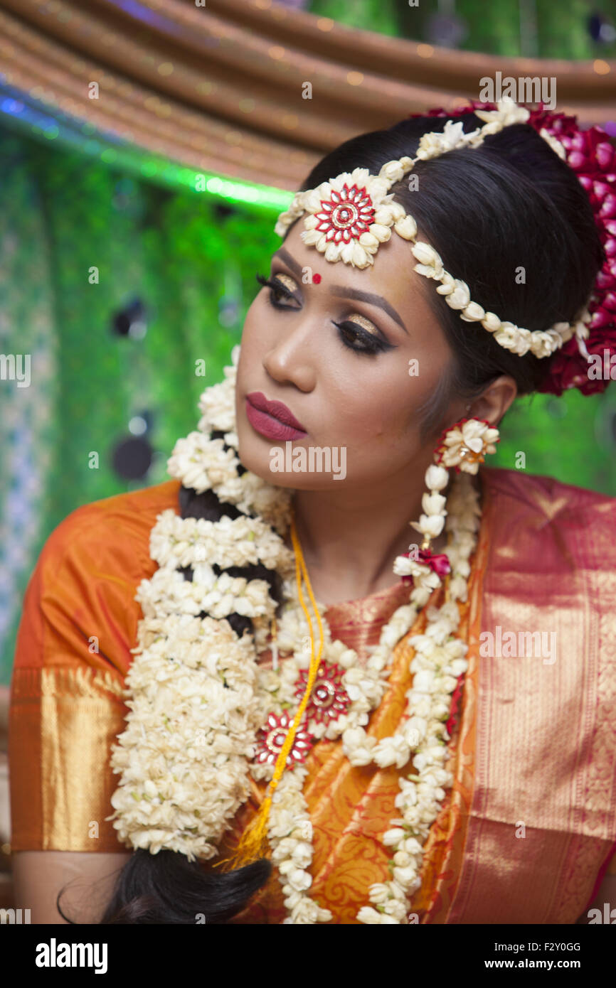 Young Bangladeshi American bride at her wedding reception in Brooklyn, NY. Stock Photo