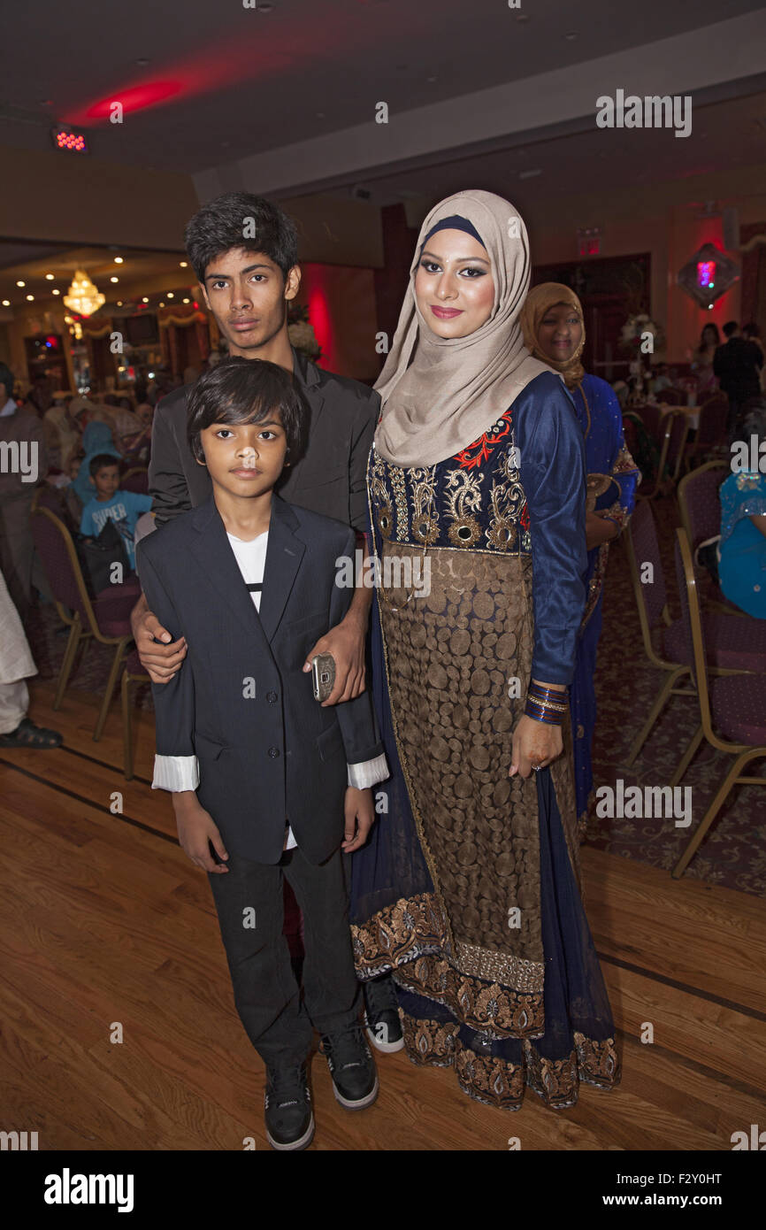 Guests at a Bangladeshi Muslim wedding reception, Brooklyn, NY. Stock Photo