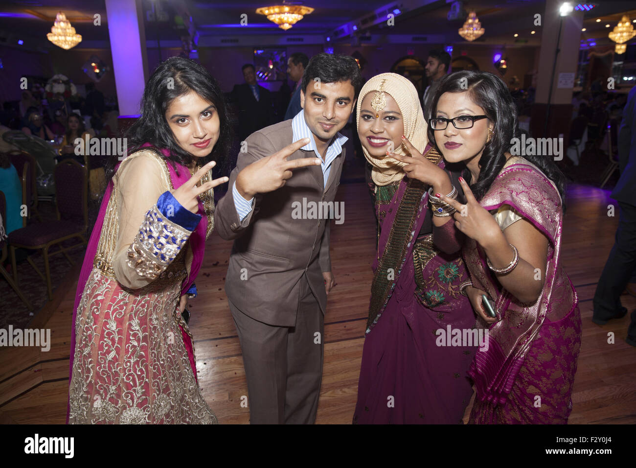 Group Of Teenage Guests At A Bangladeshi Muslim Wedding Reception
